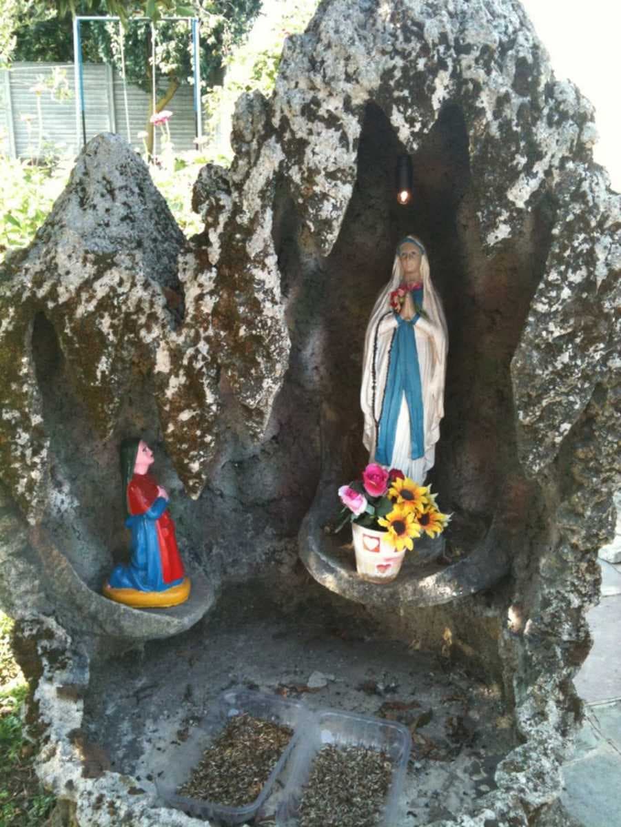 The apparition at Lourdes, represented in a cave