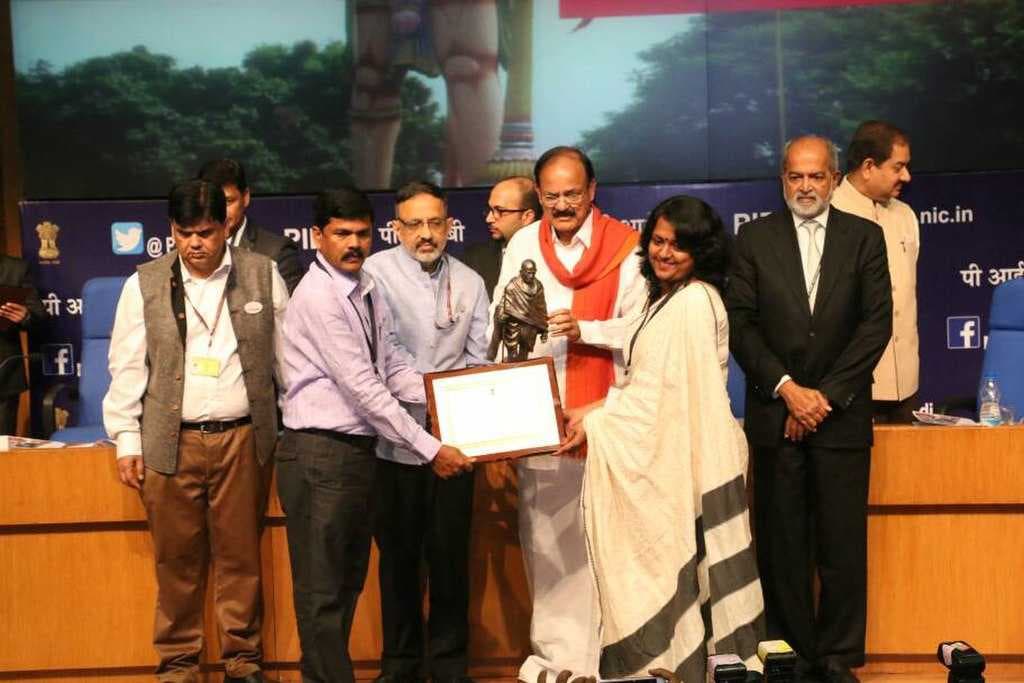 Rourkela Municipal Commissioner and Rourkela ADM taking award from Shri M.Venkaiah Naidu