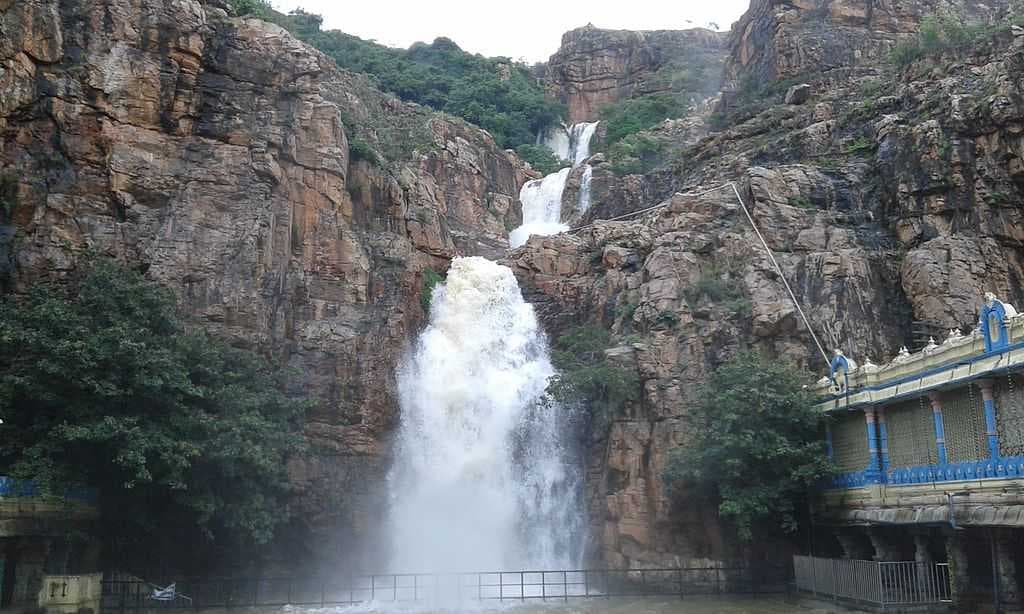 Kapila Theertham water falls from Seshachalam Hills and Kapileswara Temple (right)