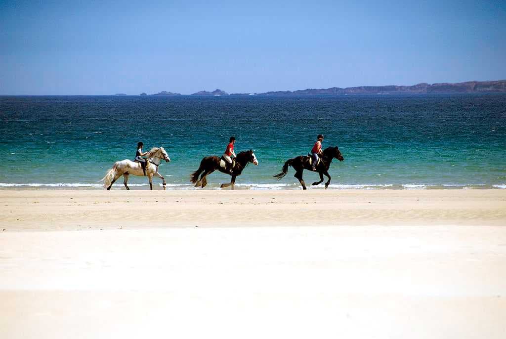 Horse riding on Tramore Beach in Downings