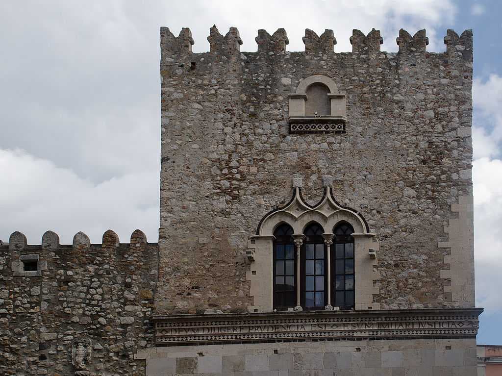 The tower of the 13th century Palazzo Corvaja showing the Gothic influence.