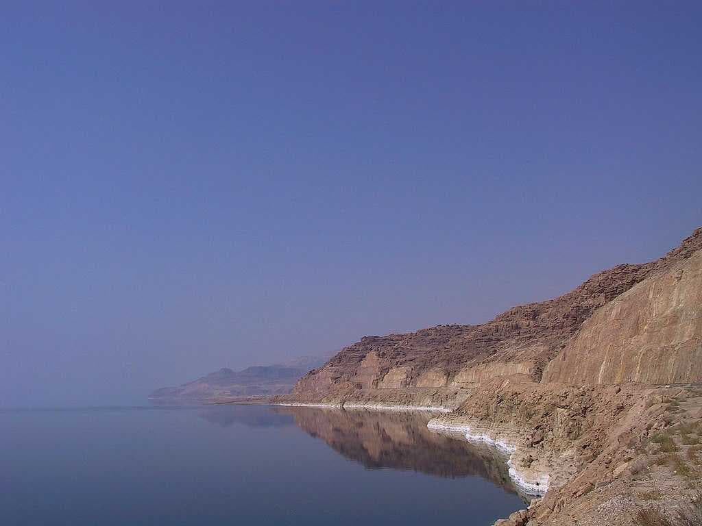 The Jordanian shore of the Dead Sea, showing salt deposits left behind by falling water levels.