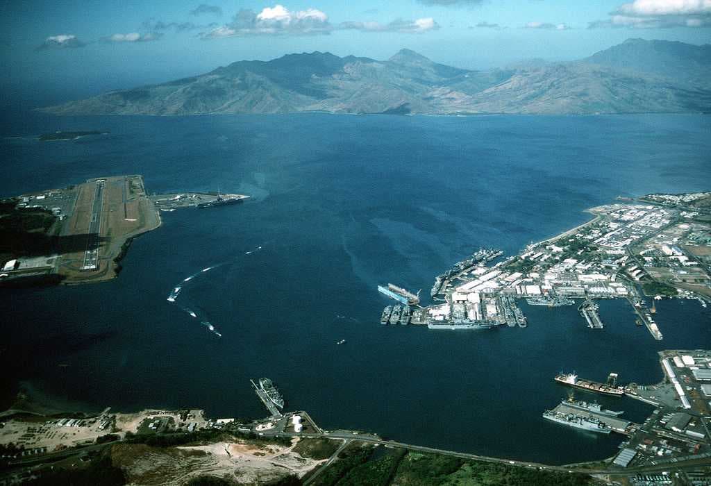 Aerial view of US Naval Base Subic Bay to the right and Naval Air Station Cubi Point to the left in 1990.