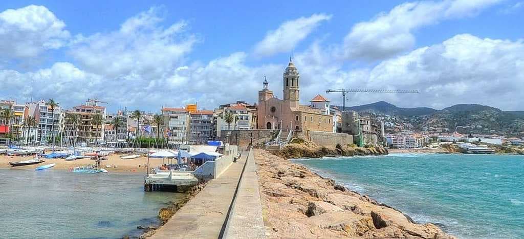 The Beach and Church of Sant Bartomeu i Santa Tecla (church built in 17th-century with numerous later modifications.)