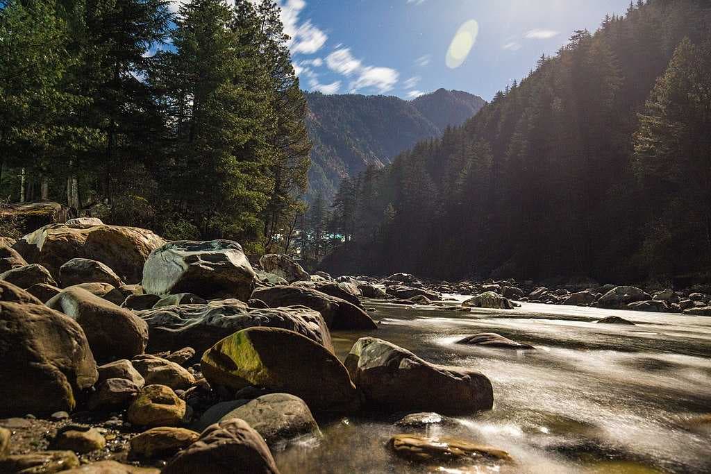 The Moonlit Parvati River flowing beside the Kasol Town, Himachal Pradesh