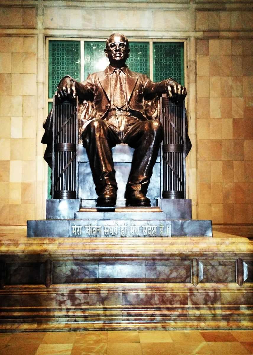 The bronze statue of Ambedkar in Ambedkar Memorial; the base is inscribed "My struggle of life is my only message." The Ambedkar statue was modeled on the sculpture of Abraham Lincoln at the Lincoln Memorial in Washington, D.C..