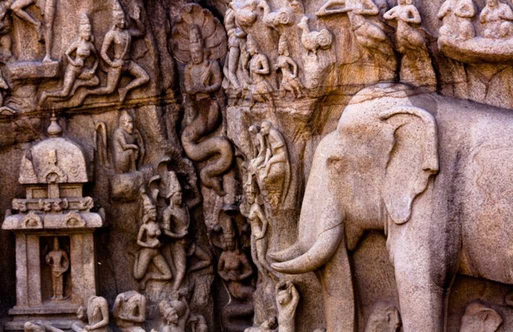 Detailing of sculptures showing the Vishnu temple to the right of the cleft