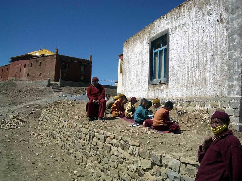 Young monks studying in the sun. Tangyud Gompa. 2004.
