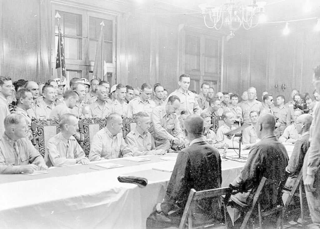 General Yamashita (center, on the near side of the table) at the surrender ceremony at Camp John Hay on September 3, 1945.
