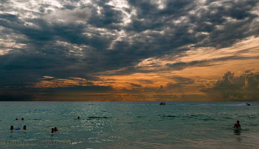 People Enjoying Water Activities at Kata Noi Beach